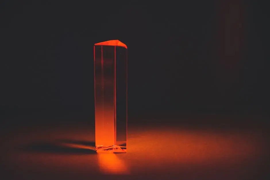 A striking image of a red prism casting shadows in a dark setting, creating a mysterious atmosphere.