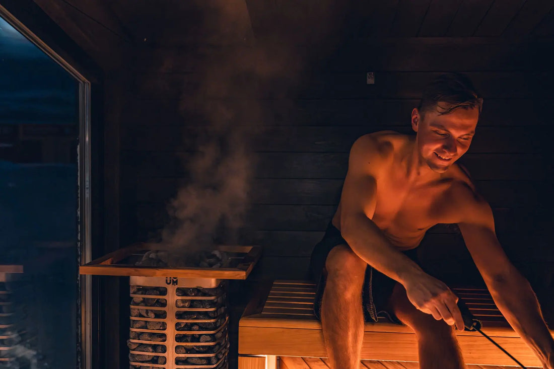 A man enjoying a warm and relaxing sauna session, embracing Nordic design.