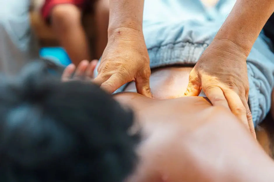 An outdoor therapeutic massage focused on the back, offering relaxation and tension relief.